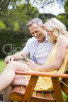 Happy couple sitting on a bench