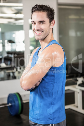 Handsome man with arms crossed looking at camera