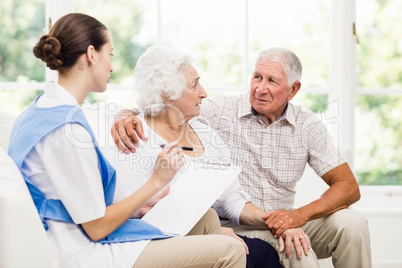 Nurse taking care of sick elderly patients