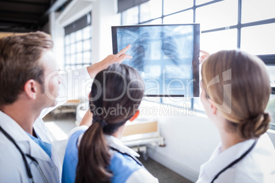 Medical team looking at x-ray together