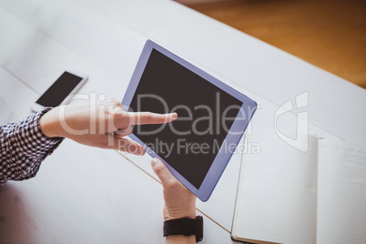 Businesswoman using her tablet