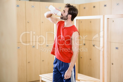 Handsome man drinking water