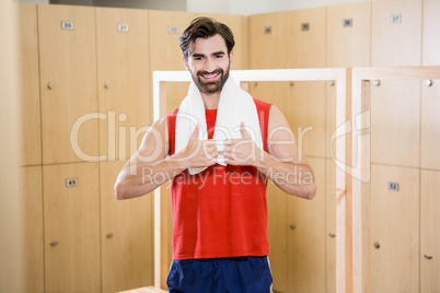 Smiling man showing thumbs up