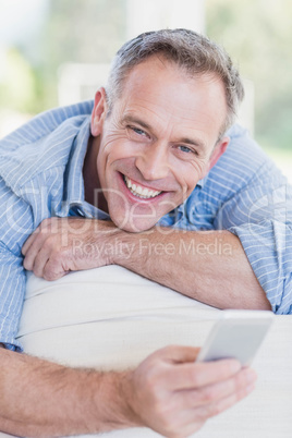 Happy man using smartphone Happy man using smartphone