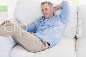 Happy man relaxing on the couch