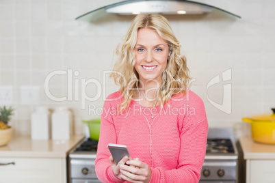 Pretty woman listening to music with headphones