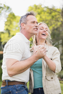 Cute couple dancing and holding hands