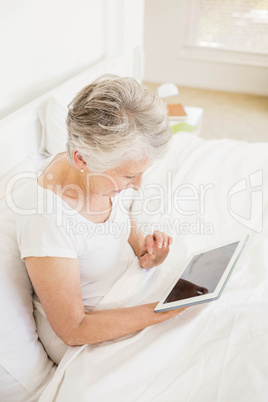 Smiling woman using tablet