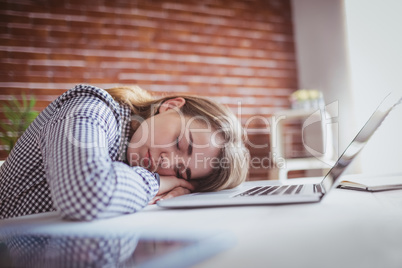 Tired hipster businesswoman sleeping