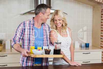 Cute couple preparing breakfast