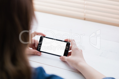 Close up view of businesswoman using her phone