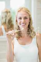 Beautiful woman brushing her teeth