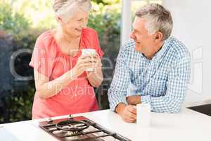 Happy senior couple drinking coffee