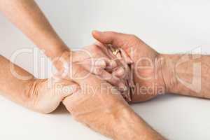 Seniors hands together