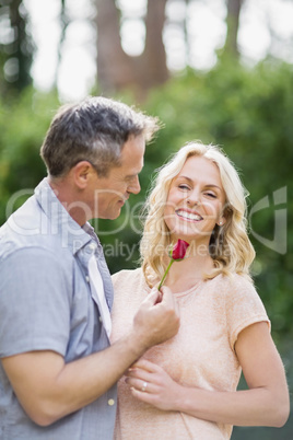 Husband offering a rose to wife