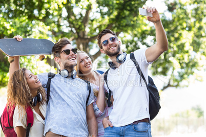 Hip friends taking selfie