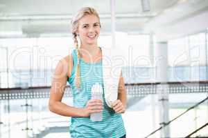 Smiling blonde holding bottle