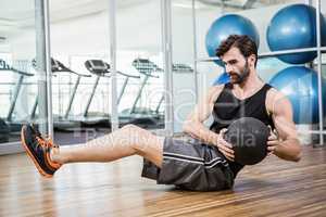 Man doing exercise with medicine ball