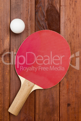 Tennis racket and a plastic ball