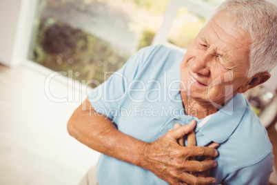 Painful senior man with pain on heart