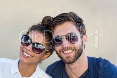 Hip couple smiling at the camera