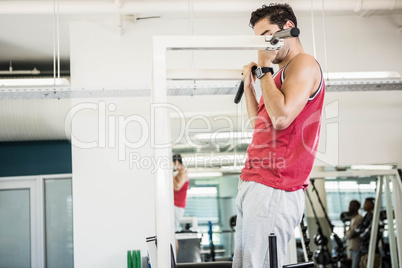 Muscular man doing pull up