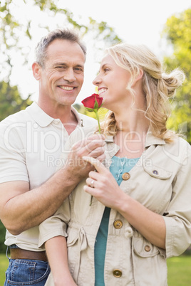 Husband offering a rose to wife