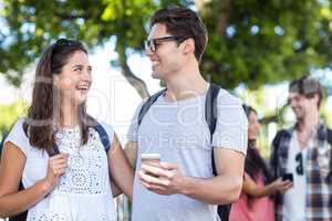 Hip couples checking at smartphone