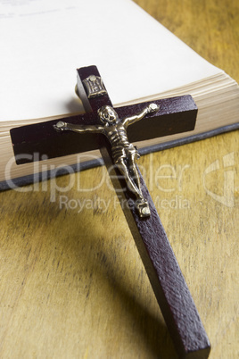 Catholic cross on the book