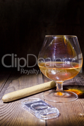 Cognac in glass and cigar