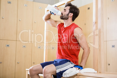 Handsome man drinking water