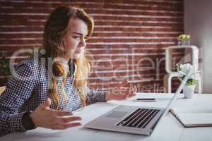 Young hipster businesswoman misunderstanding her laptop