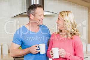 Cute couple having a mug of tea