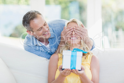 Husband surprising wife with a present