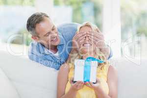 Husband surprising wife with a present