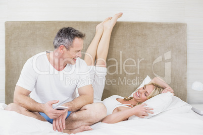 Cute Couple Cuddling On Their Bed Lizenzfreie Bilder Und Fotos