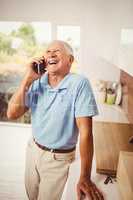 Smiling senior man on a phone call