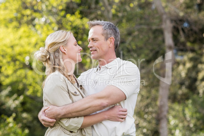 Cute couple hugging with arms around