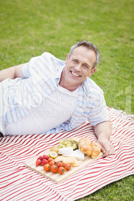 Happy man having a picnic