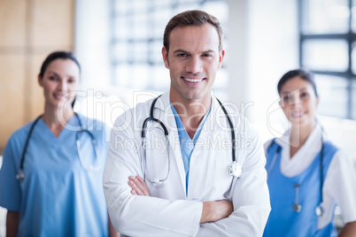 Smiling medical team with arms crossed