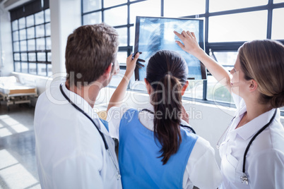 Medical team looking at x-ray together