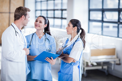 Medical team discussing the report together