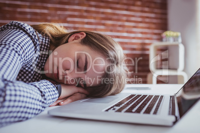 Tired hipster businesswoman sleeping