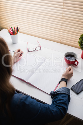 Casual businesswoman working at her desk