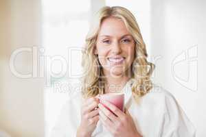Pretty woman having a cup of coffee