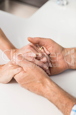 Seniors hands together