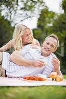 Happy couple having a picnic