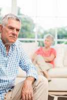 Upset senior man after arguing with wife