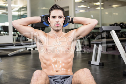 Shirtless man doing sitting up