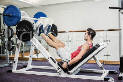 Muscular man doing exercise for legs